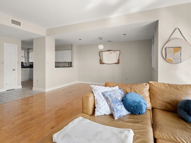 living room with light hardwood / wood-style floors