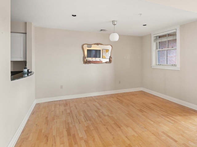 unfurnished dining area featuring light hardwood / wood-style floors