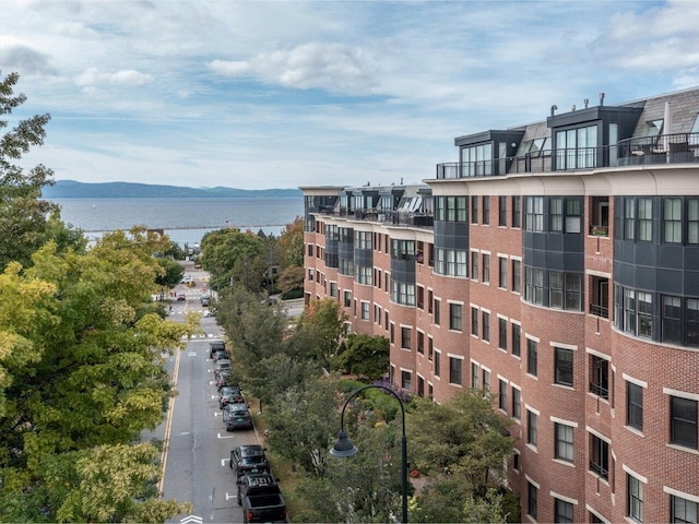 view of property featuring a water and mountain view