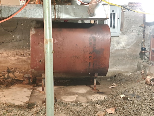 unfinished basement featuring electric panel
