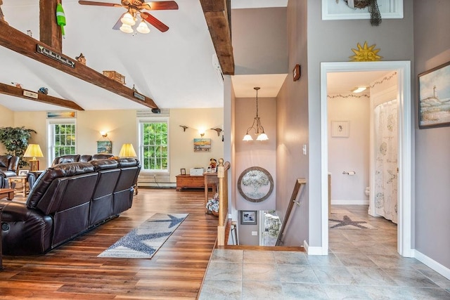 living room with high vaulted ceiling, hardwood / wood-style floors, beamed ceiling, and ceiling fan