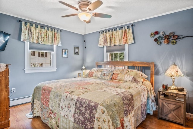 bedroom with a baseboard radiator, a textured ceiling, ceiling fan, hardwood / wood-style flooring, and ornamental molding