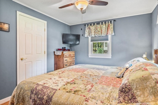 bedroom featuring ornamental molding and ceiling fan