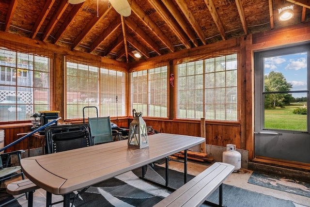 sunroom / solarium featuring vaulted ceiling, ceiling fan, and a wealth of natural light