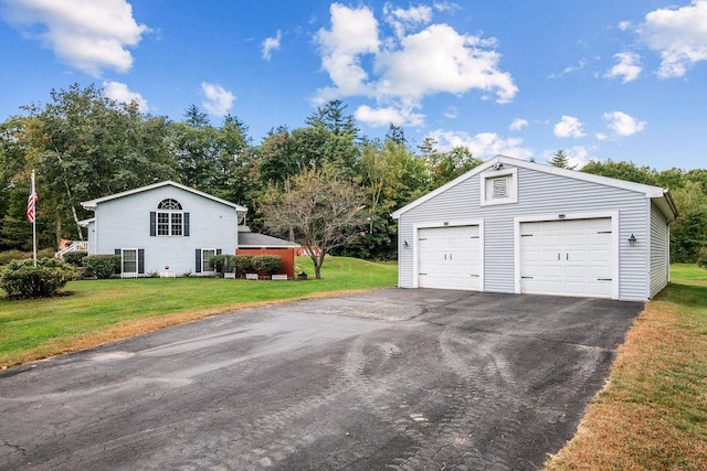 garage featuring a lawn