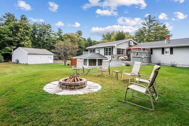 view of yard with a patio area and an outdoor fire pit