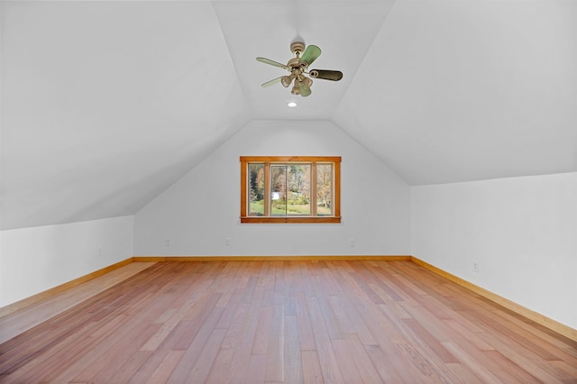 additional living space featuring lofted ceiling, light hardwood / wood-style floors, and ceiling fan