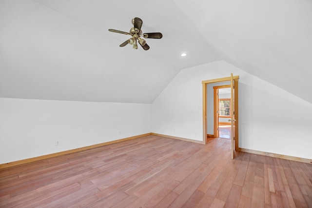 additional living space featuring light hardwood / wood-style floors, lofted ceiling, and ceiling fan