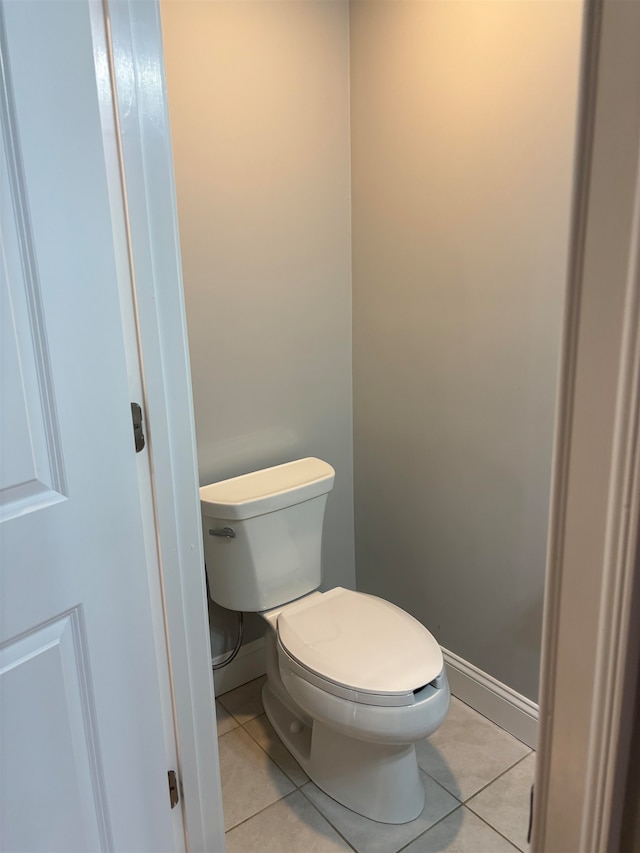 bathroom with tile patterned flooring and toilet