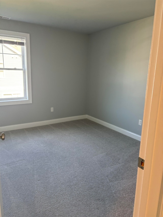 spare room featuring carpet