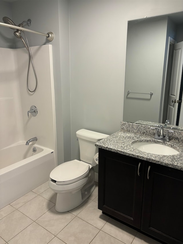 full bathroom featuring tile patterned flooring, vanity, toilet, and shower / tub combination