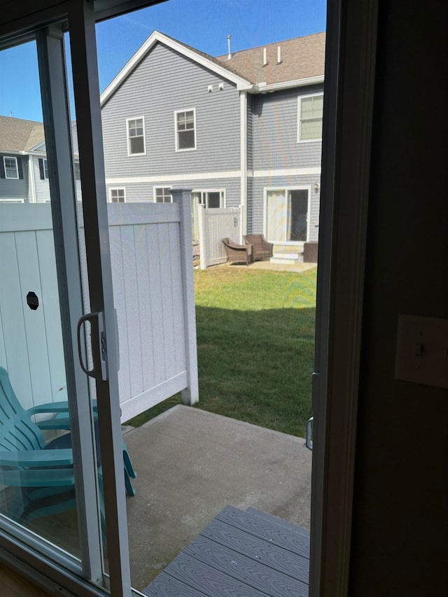 doorway to outside featuring concrete floors