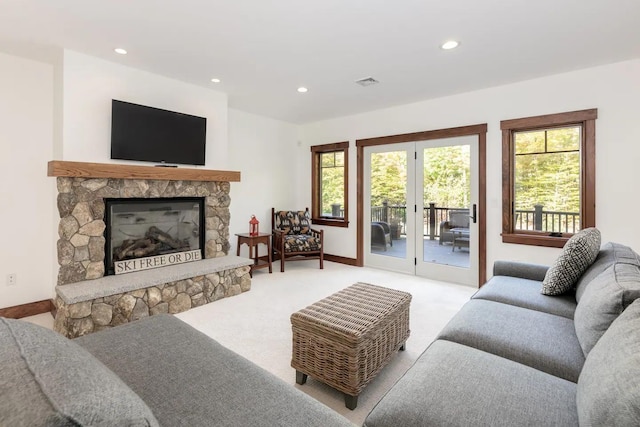 16 Crooked Mountain Rd, Lincoln, NH 03251 - living area featuring recessed lighting, plenty of natural light, light carpet, and a stone fireplace