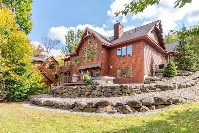 16 Crooked Mountain Rd, Lincoln, NH 03251 - rear view of property with a chimney, a lawn, a balcony, and a shingled roof