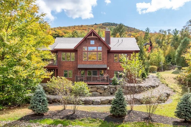 16 Crooked Mountain Rd, Lincoln, NH 03251 - back of house with a chimney