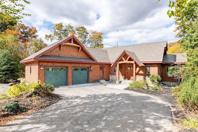 16 Crooked Mountain Rd, Lincoln, NH 03251 - view of front facade with an attached garage, driveway, and a shingled roof