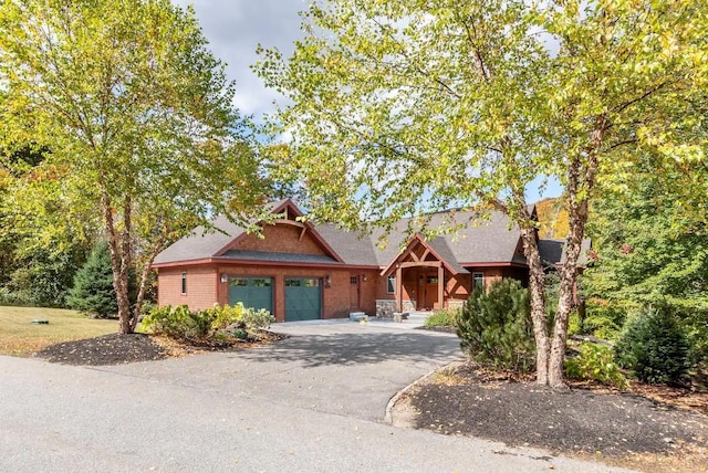 16 Crooked Mountain Rd, Lincoln, NH 03251 - view of front of home with a garage, asphalt driveway, and a shingled roof