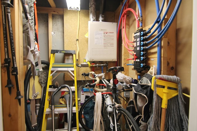 utility room with water heater