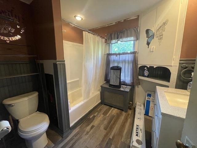 full bathroom featuring shower / tub combo, vanity, toilet, and hardwood / wood-style flooring