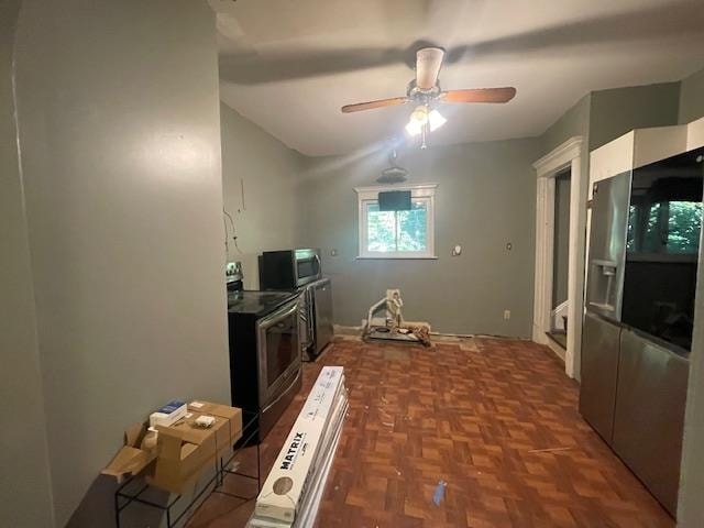 kitchen featuring stainless steel appliances, ceiling fan, and dark parquet floors