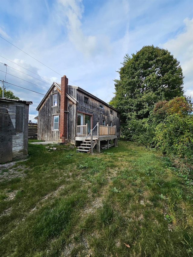 view of yard featuring a wooden deck