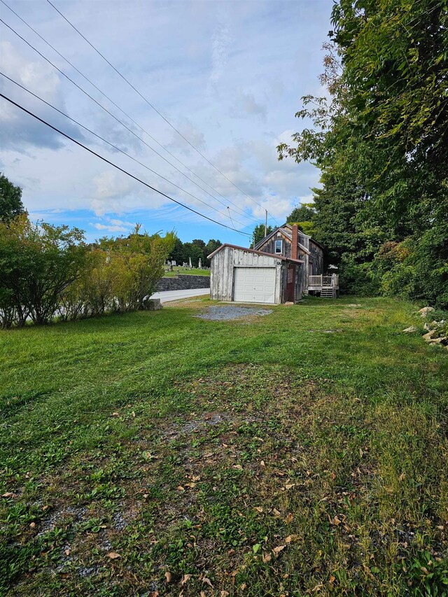 view of yard with a garage