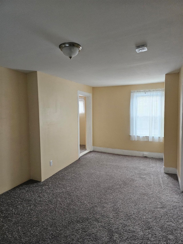 unfurnished room with carpet flooring