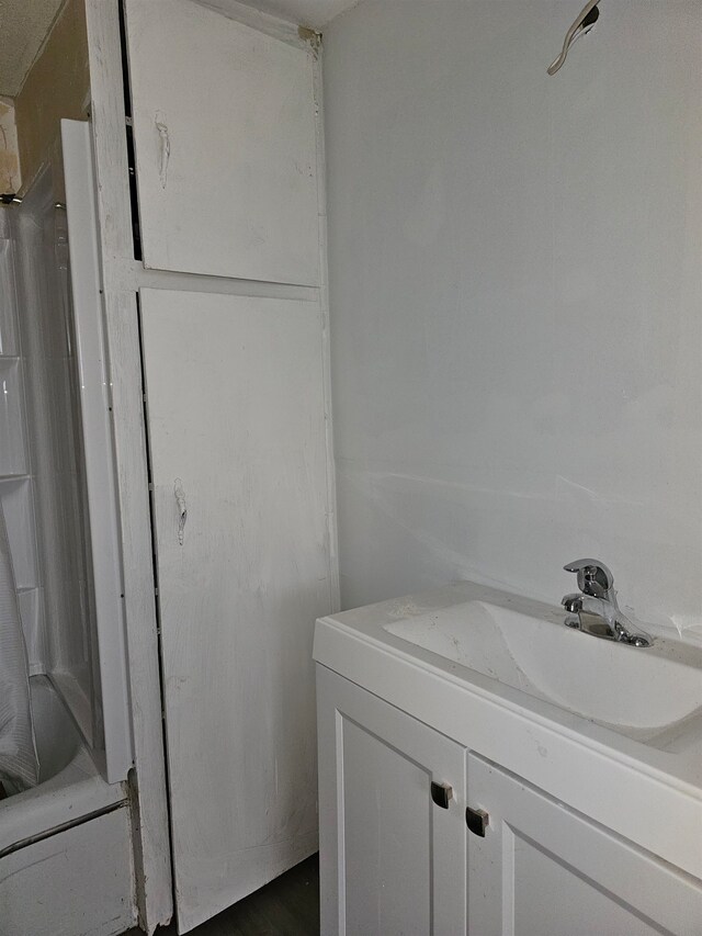 bathroom with tub / shower combination and vanity