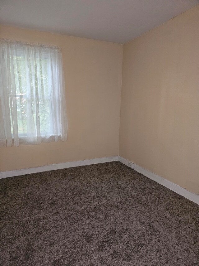 empty room with carpet flooring