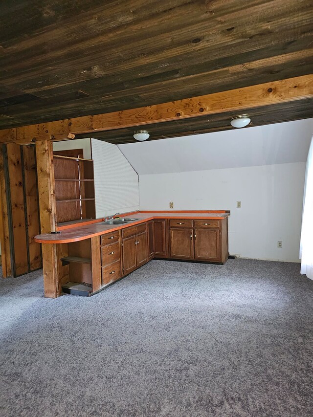 interior space with lofted ceiling, sink, and wood ceiling