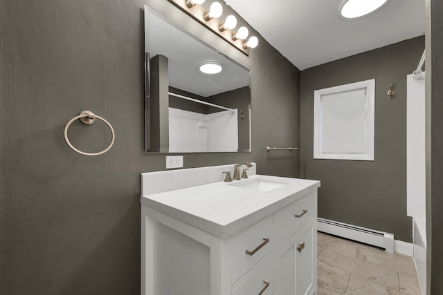 bathroom with vanity, baseboard heating, and shower / bath combination