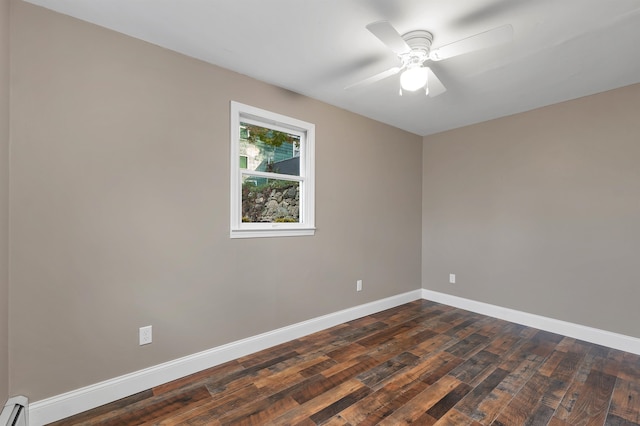 spare room with ceiling fan, baseboard heating, and dark hardwood / wood-style flooring