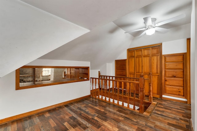 additional living space with vaulted ceiling, ceiling fan, and dark hardwood / wood-style flooring