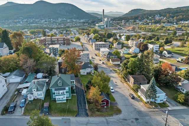 birds eye view of property with a mountain view