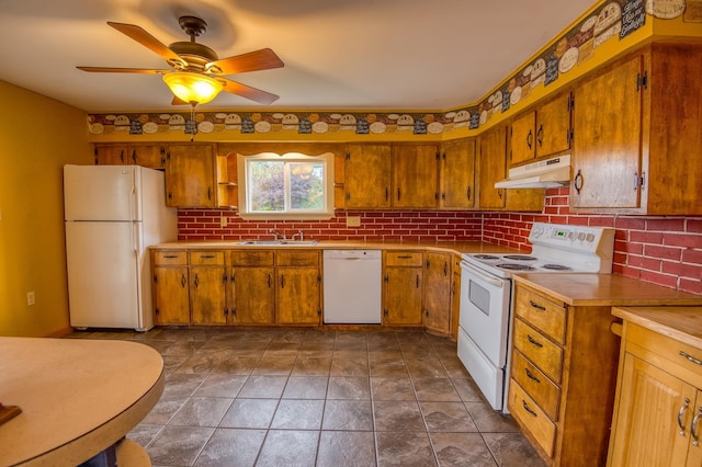 kitchen featuring under cabinet range hood, brown cabinets, white appliances, and a ceiling fan