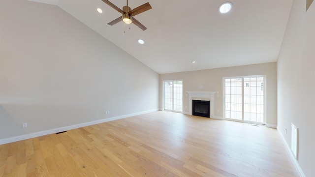 unfurnished living room featuring ceiling fan, light hardwood / wood-style floors, and high vaulted ceiling