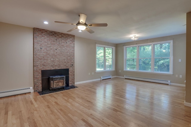 unfurnished living room featuring light hardwood / wood-style floors, a fireplace, ceiling fan, and a baseboard radiator