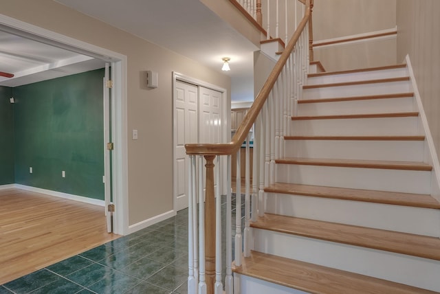 staircase with wood-type flooring