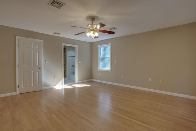 unfurnished bedroom with ceiling fan, light hardwood / wood-style flooring, and connected bathroom