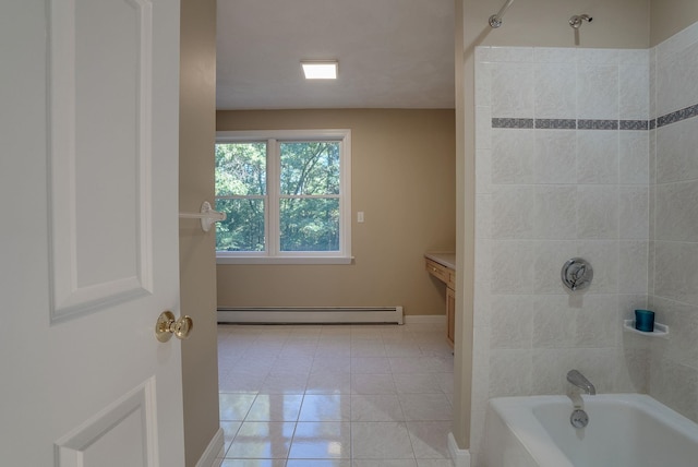 bathroom featuring vanity, baseboard heating, tiled shower / bath combo, and tile patterned flooring