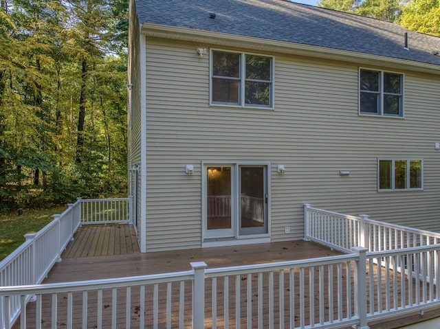 rear view of house featuring a deck