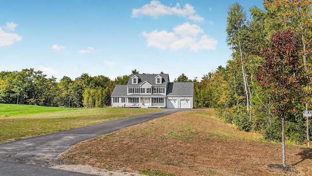 new england style home with a front yard