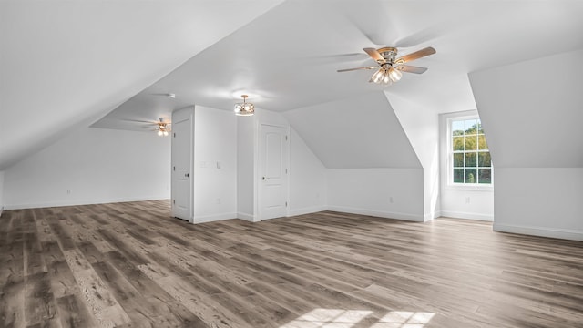 additional living space with vaulted ceiling, ceiling fan, and hardwood / wood-style floors