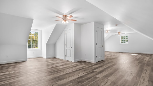 bonus room with vaulted ceiling, ceiling fan, and hardwood / wood-style flooring