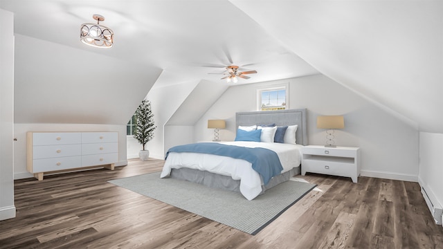 bedroom with ceiling fan, lofted ceiling, and dark hardwood / wood-style floors