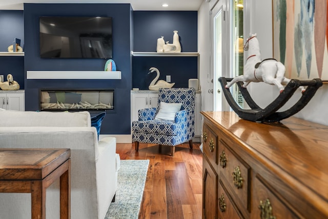 living area featuring hardwood / wood-style floors