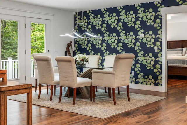 dining space with hardwood / wood-style floors