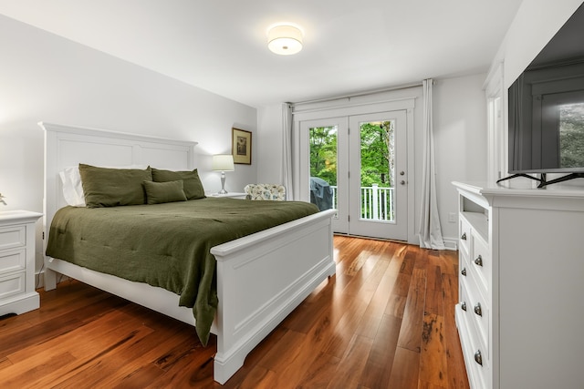 bedroom with wood-type flooring and access to exterior