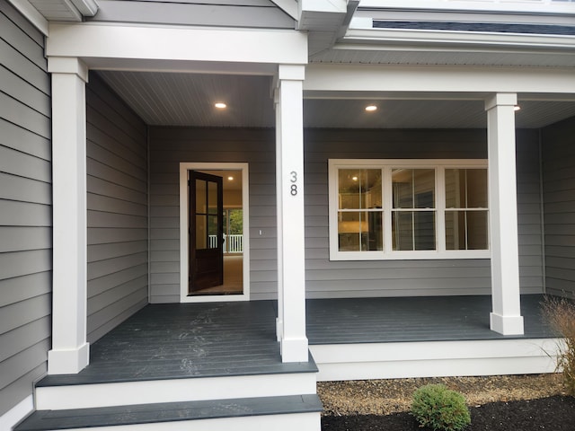 view of exterior entry featuring a porch