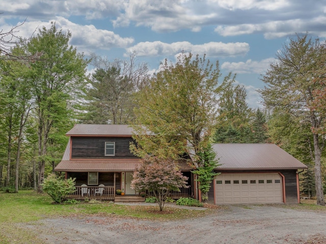 view of front of property featuring a garage and covered porch